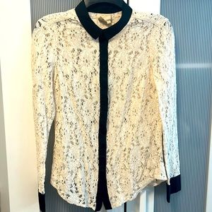 Cream lace with black trim blouse.